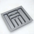 Gray cutlery tray with compartments on a white background