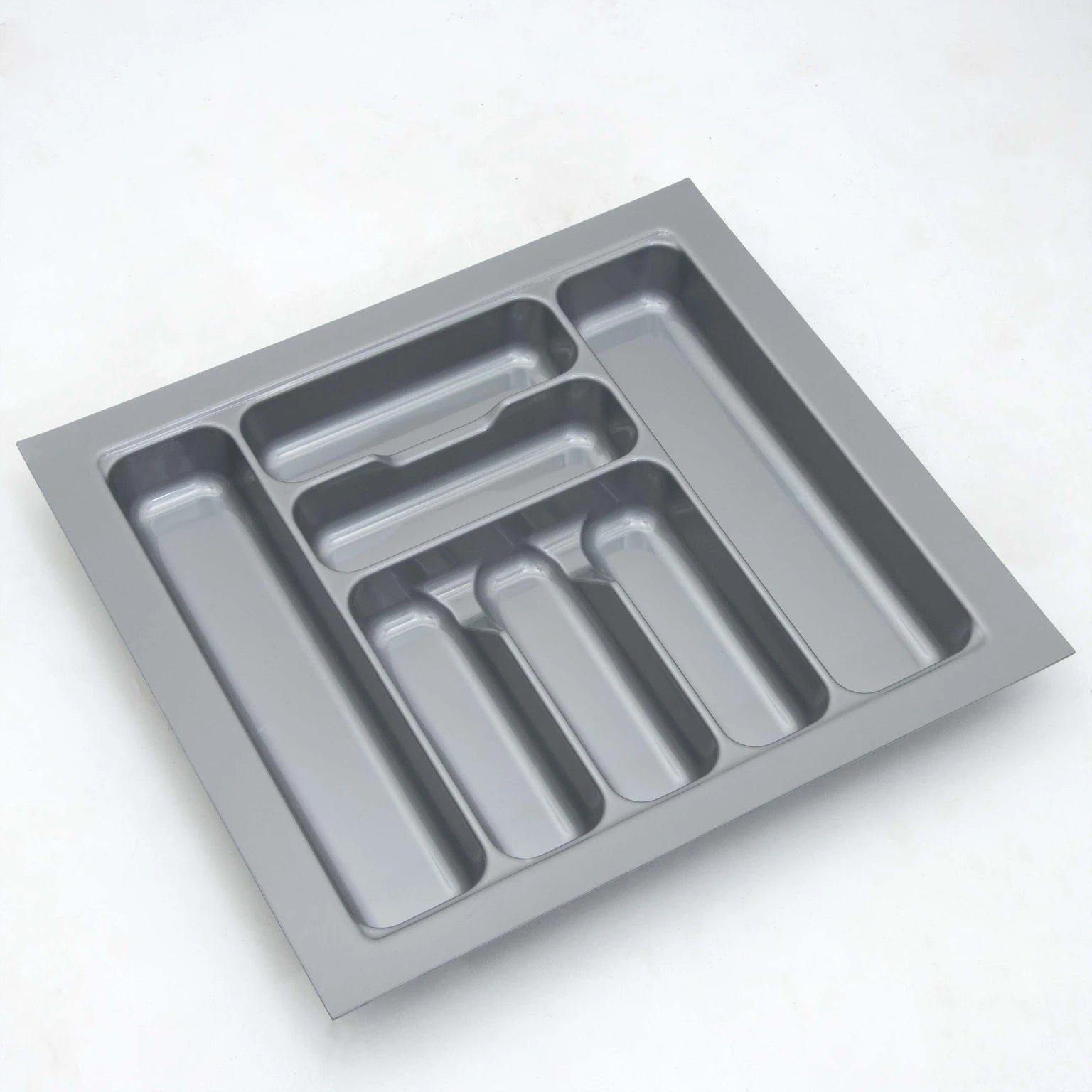 Gray cutlery tray with compartments on a white background