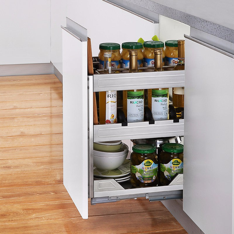 A stainless steel multifunctional cabinet drawer basket with multiple compartments, containing kitchen utensils and containers.