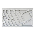 A custom fit cutlery tray in grey color with various compartments for organizing utensils.