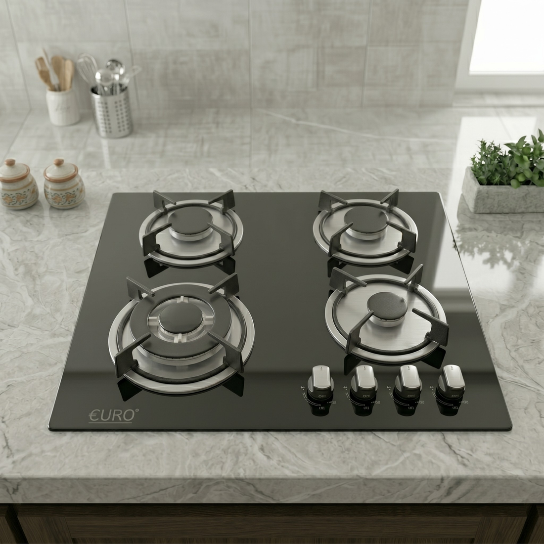 Black gas stove with four burners on a white background