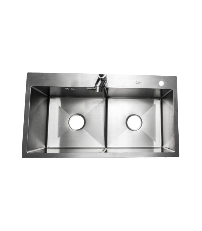 A stainless steel double bowl kitchen sink with separate faucets for each bowl.