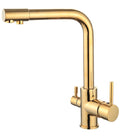 A gold-colored stainless steel kitchen sink faucet with dual handles and a high arched spout, designed in a European style.