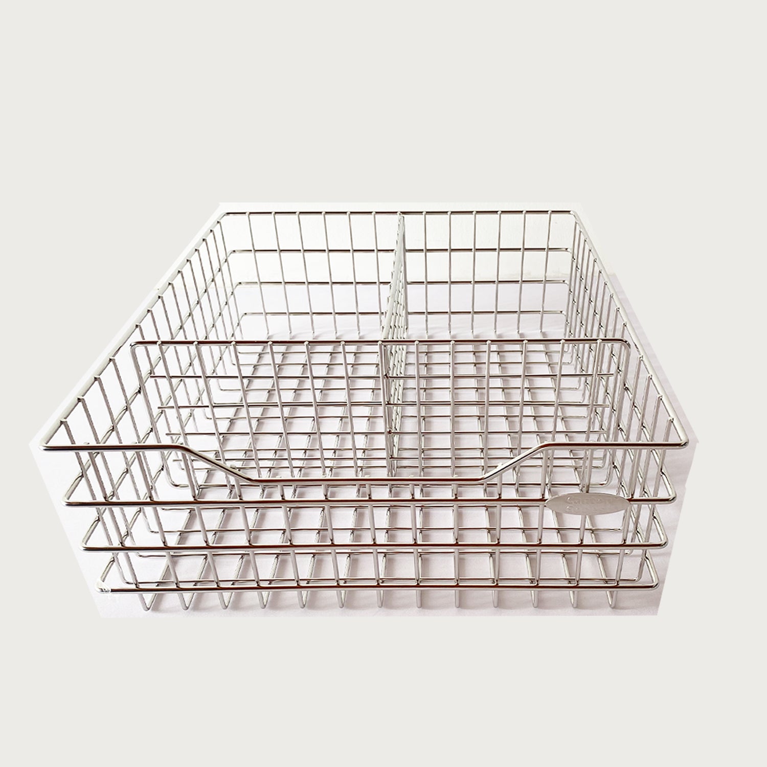 A silver steel wire pull-out basket designed for organizing kitchen utensils.