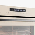 Close-up of a built-in oven control panel with a digital display and touch controls, above a glass door with a horizontal safety screen.