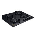 Black gas stove with four burners on a white background