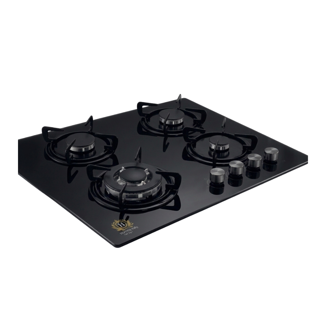 Black gas stove with four burners on a white background