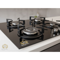 Black gas stove with four burners on a white countertop, featuring the Hovis brand logo.