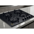 Black gas stove with four burners on a kitchen counter