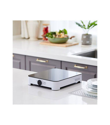 A single induction cooktop by Hanssem, placed on a kitchen countertop, surrounded by kitchenware.