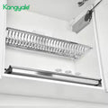 Kangyale dish drying rack mounted on a kitchen cabinet with plates inside.