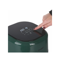 Green appliance with digital display and button being pressed by a hand, brand 'Kepper' visible.