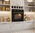 Modern kitchen with black oven and white cabinets