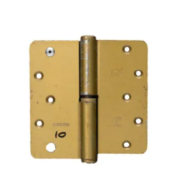 A gold-colored metal hinge with visible signs of wear and markings, typically used for cabinetry or furniture.