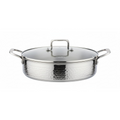 A hammered stainless steel saute pan with a matching glass lid, featuring side handles and a top handle, shown on a plain white background.
