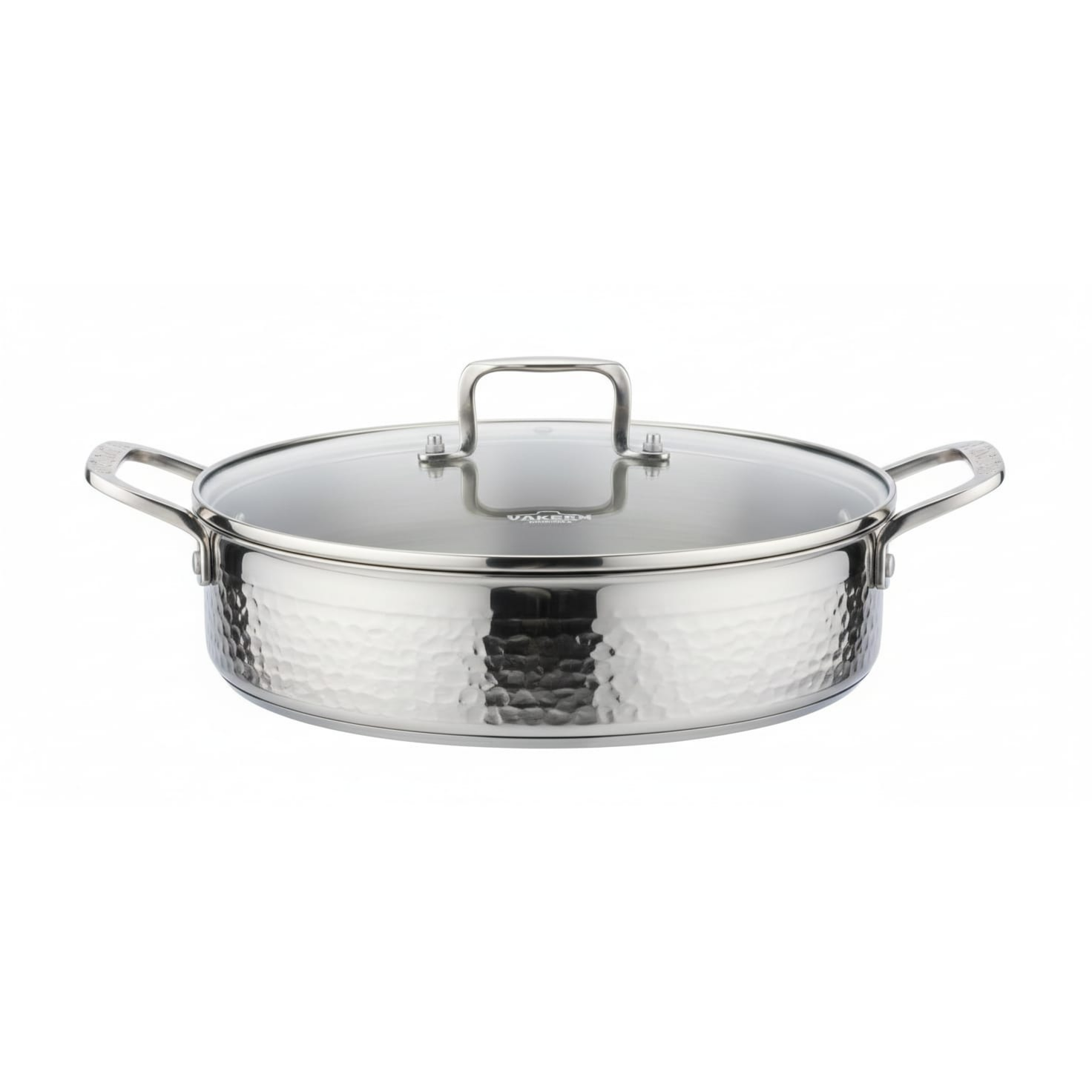 A hammered stainless steel saute pan with a matching glass lid, featuring side handles and a top handle, shown on a plain white background.