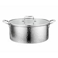 A hammered stainless steel stockpot with a matching glass lid, featuring side handles and a top handle, shown against a plain white background.