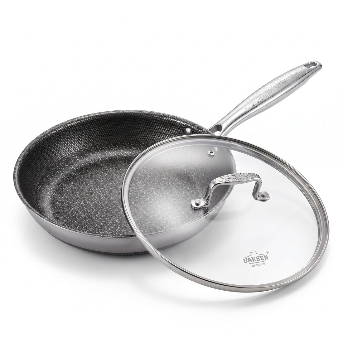 A stainless steel sauté pan with a textured non-stick interior and a clear glass lid with a stainless steel handle, shown on a white background. The brand name 'URACEN' is visible on the glass lid.