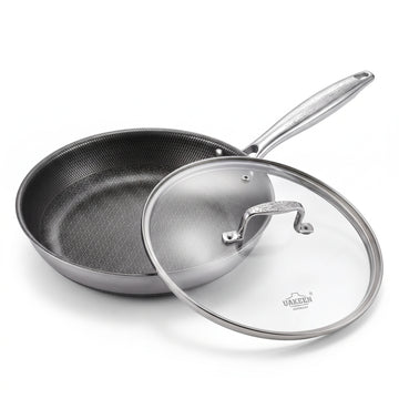 A stainless steel sauté pan with a textured non-stick interior and a clear glass lid with a stainless steel handle, shown on a white background. The brand name 'URACEN' is visible on the glass lid.